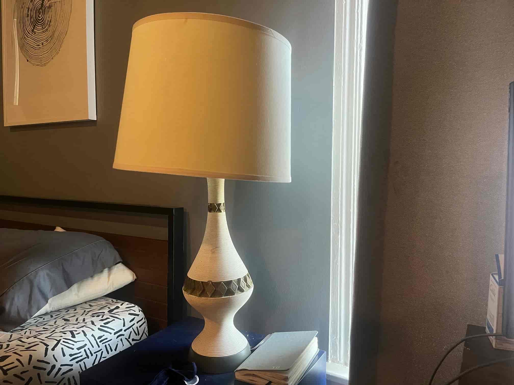 A white lamp with its lampshade jauntily set | Bellhop Moving
